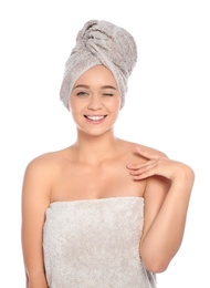 Photo of Portrait of young pretty woman with towels on white background