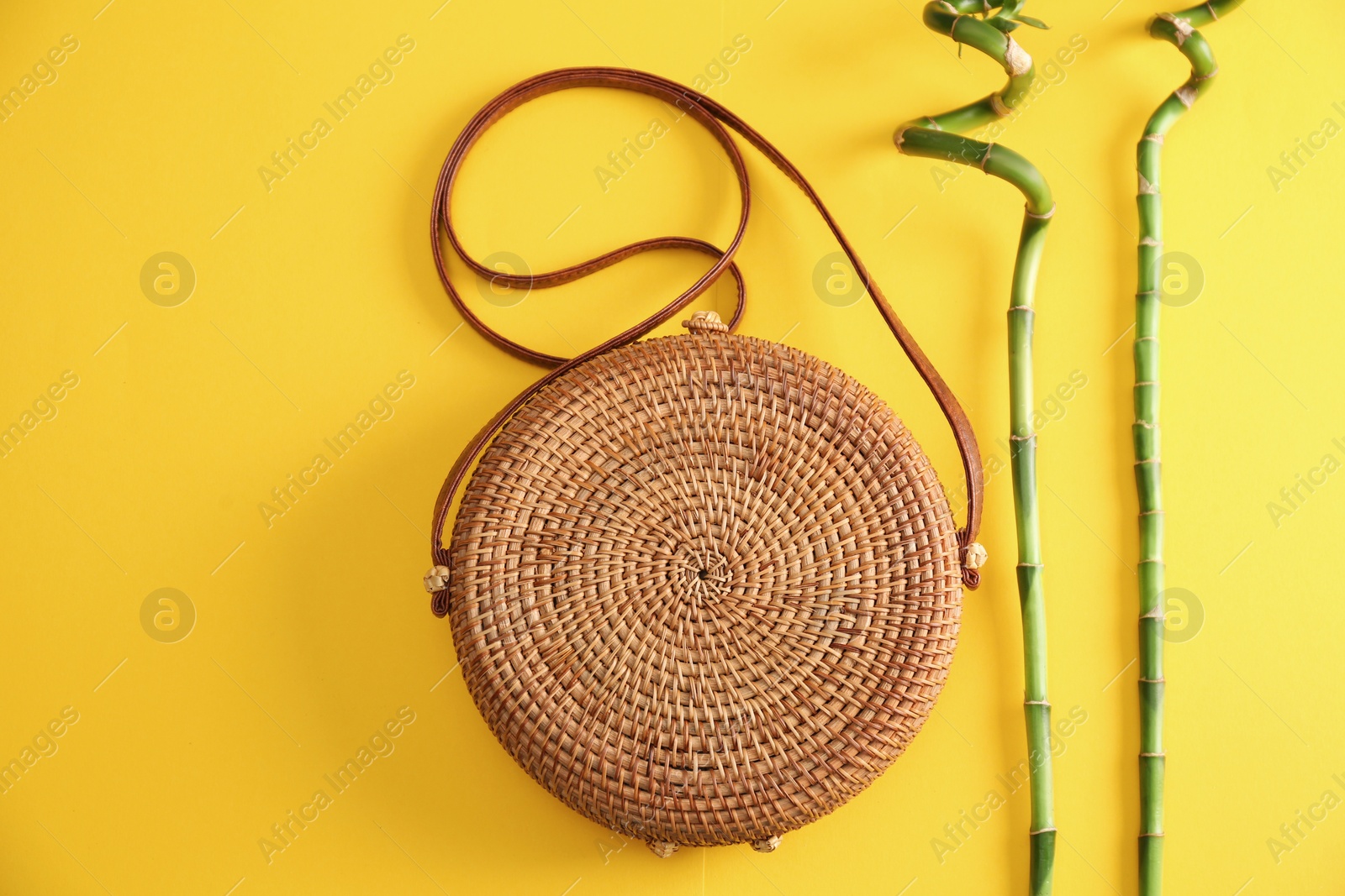 Photo of Flat lay composition with bamboo bag on color background