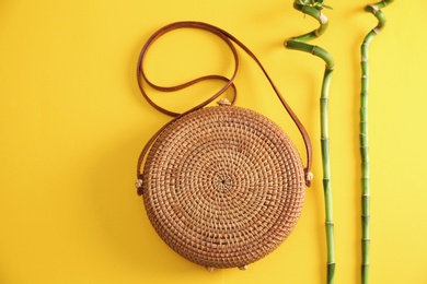 Photo of Flat lay composition with bamboo bag on color background