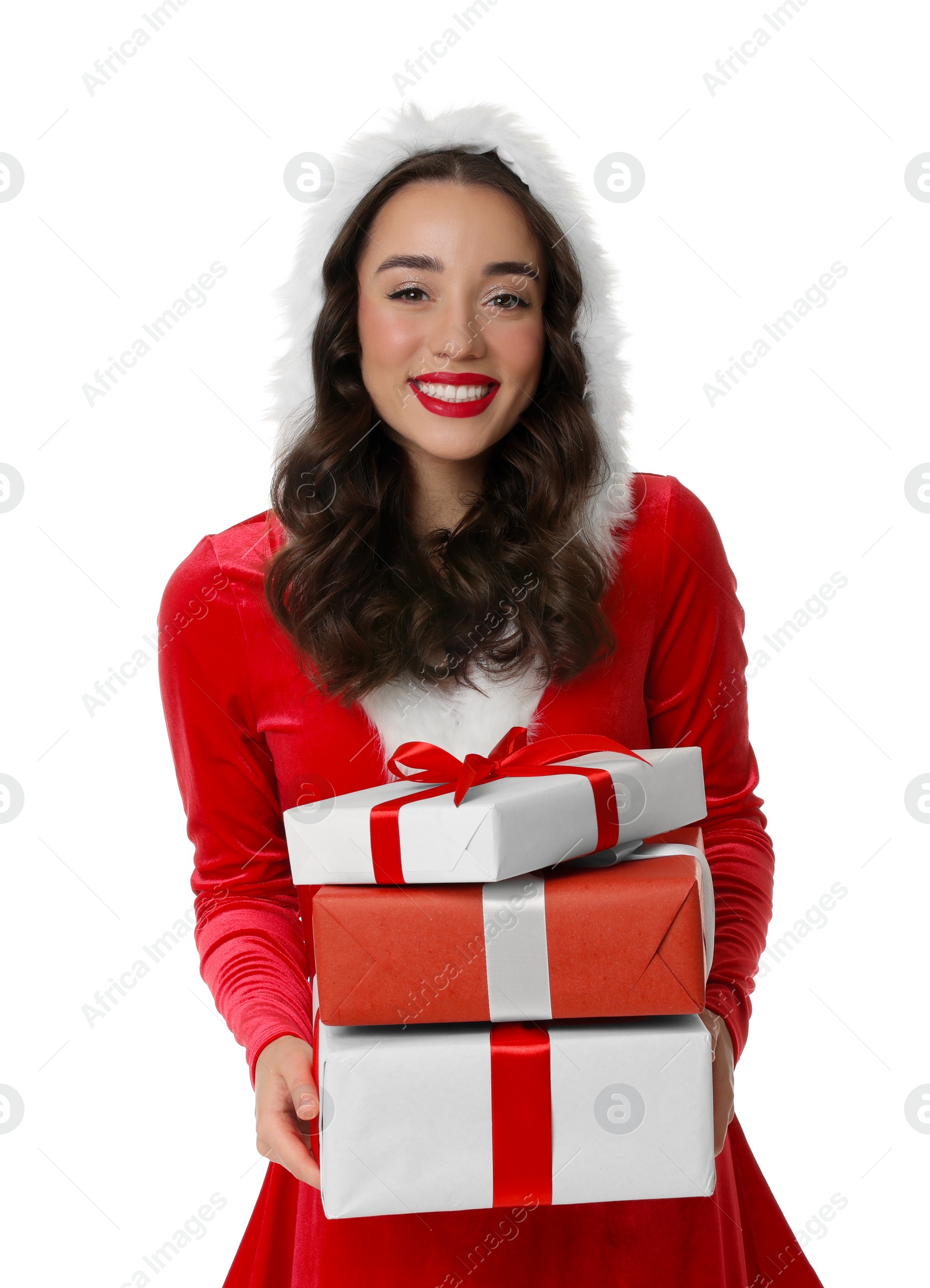 Photo of Beautiful young woman in Christmas red dress holding gift boxes isolated on white