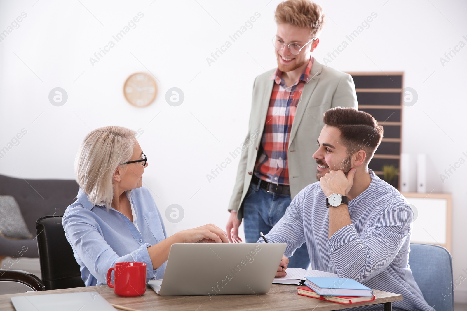 Photo of Business people discussing work matters in office. Professional communication