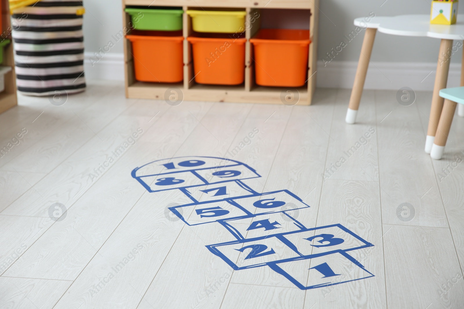 Photo of Blue hopscotch floor sticker in playing room