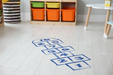 Photo of Blue hopscotch floor sticker in playing room