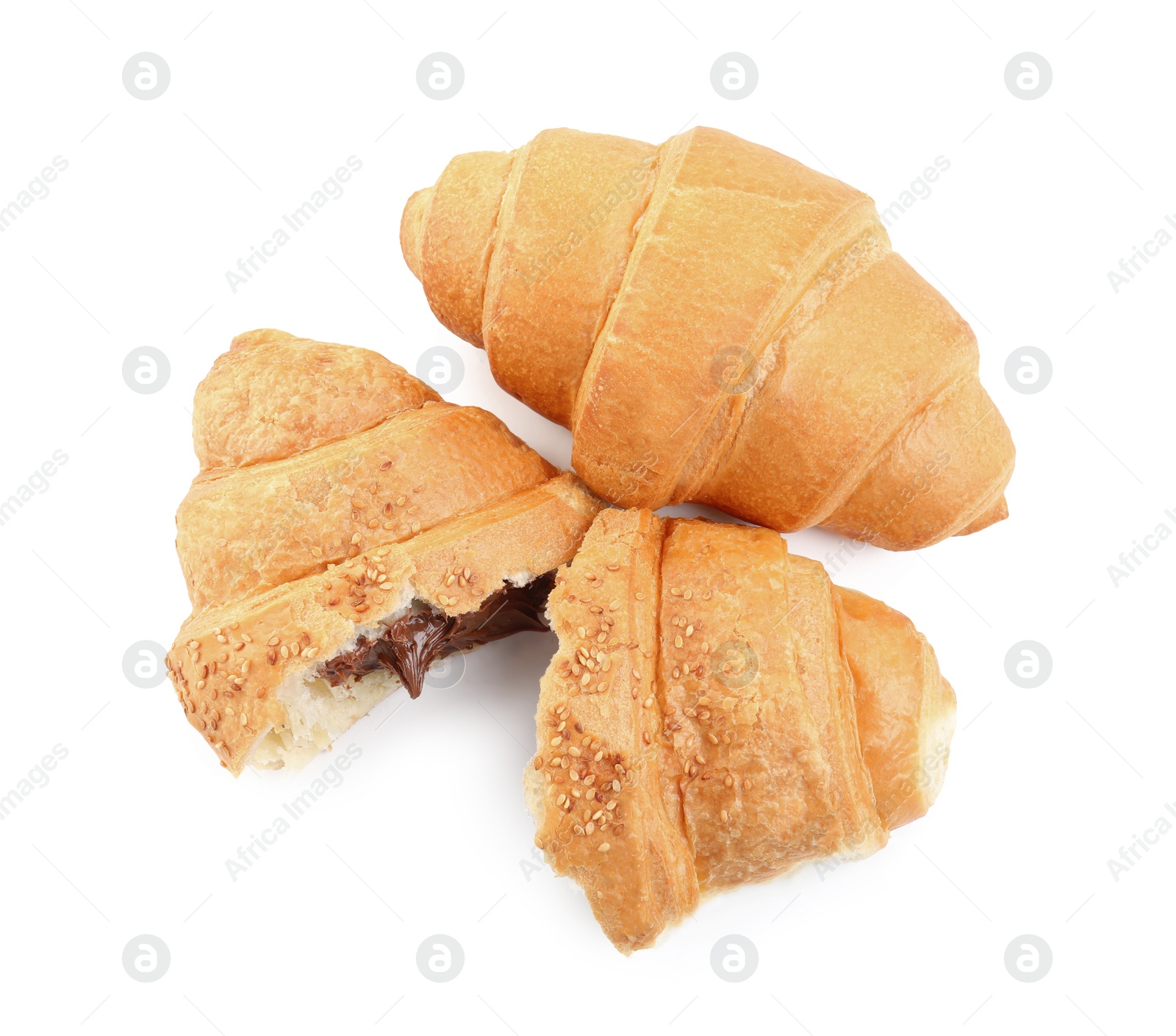 Photo of Tasty croissants with chocolate on white background, top view