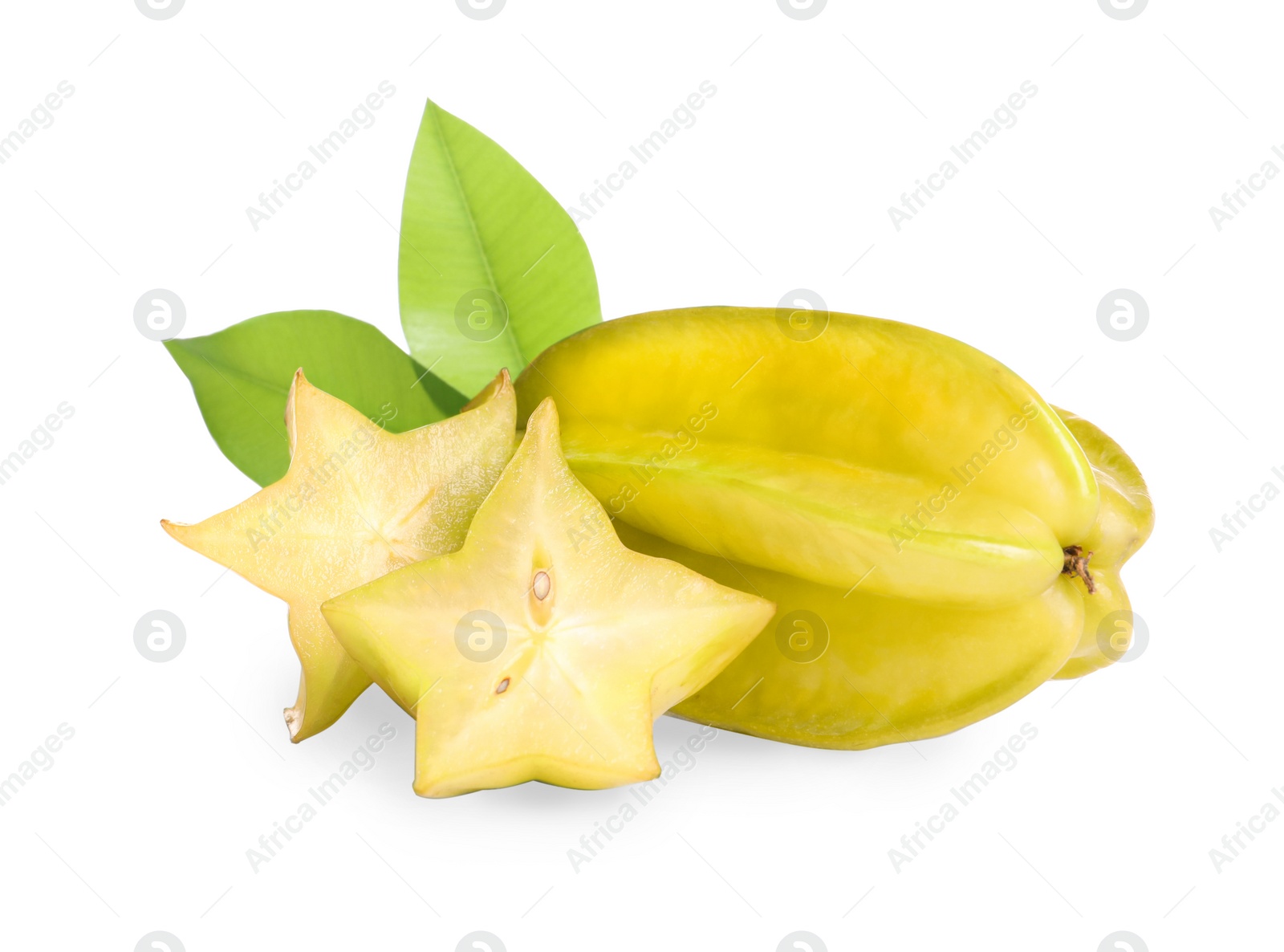 Photo of Cut and whole carambolas with green leaves on white background