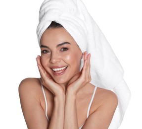 Beautiful young woman with towel on head against white background