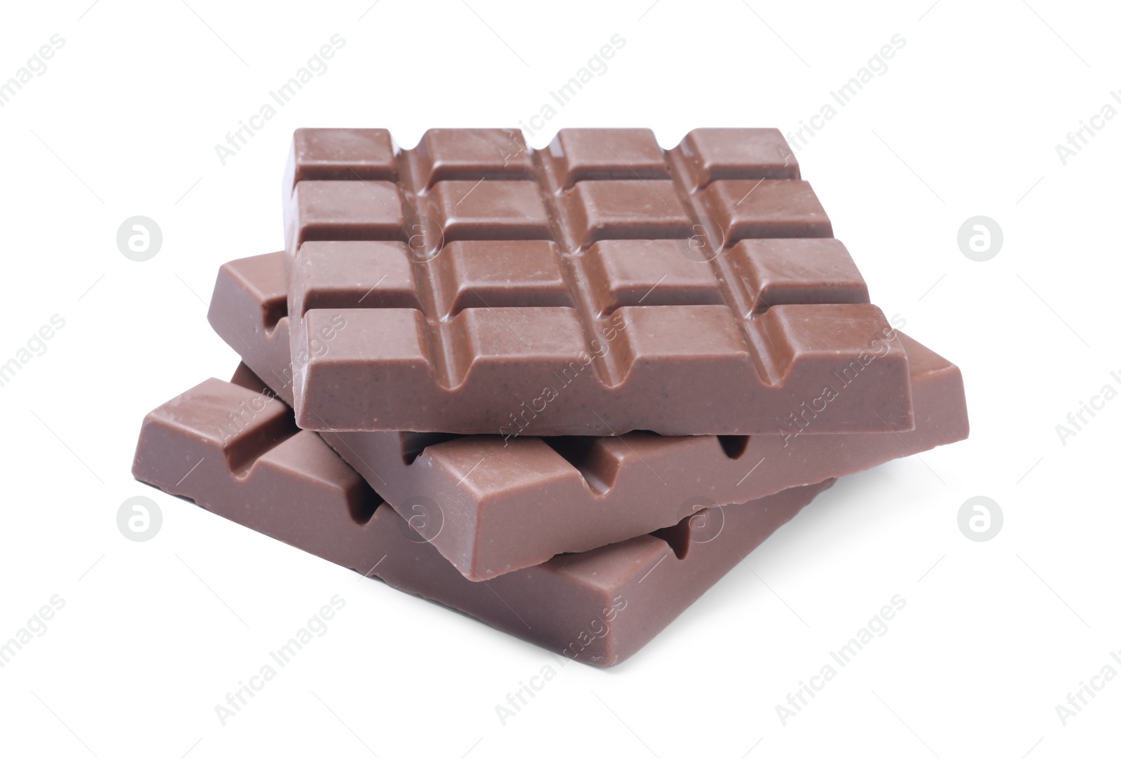 Photo of Delicious milk chocolate bars isolated on white