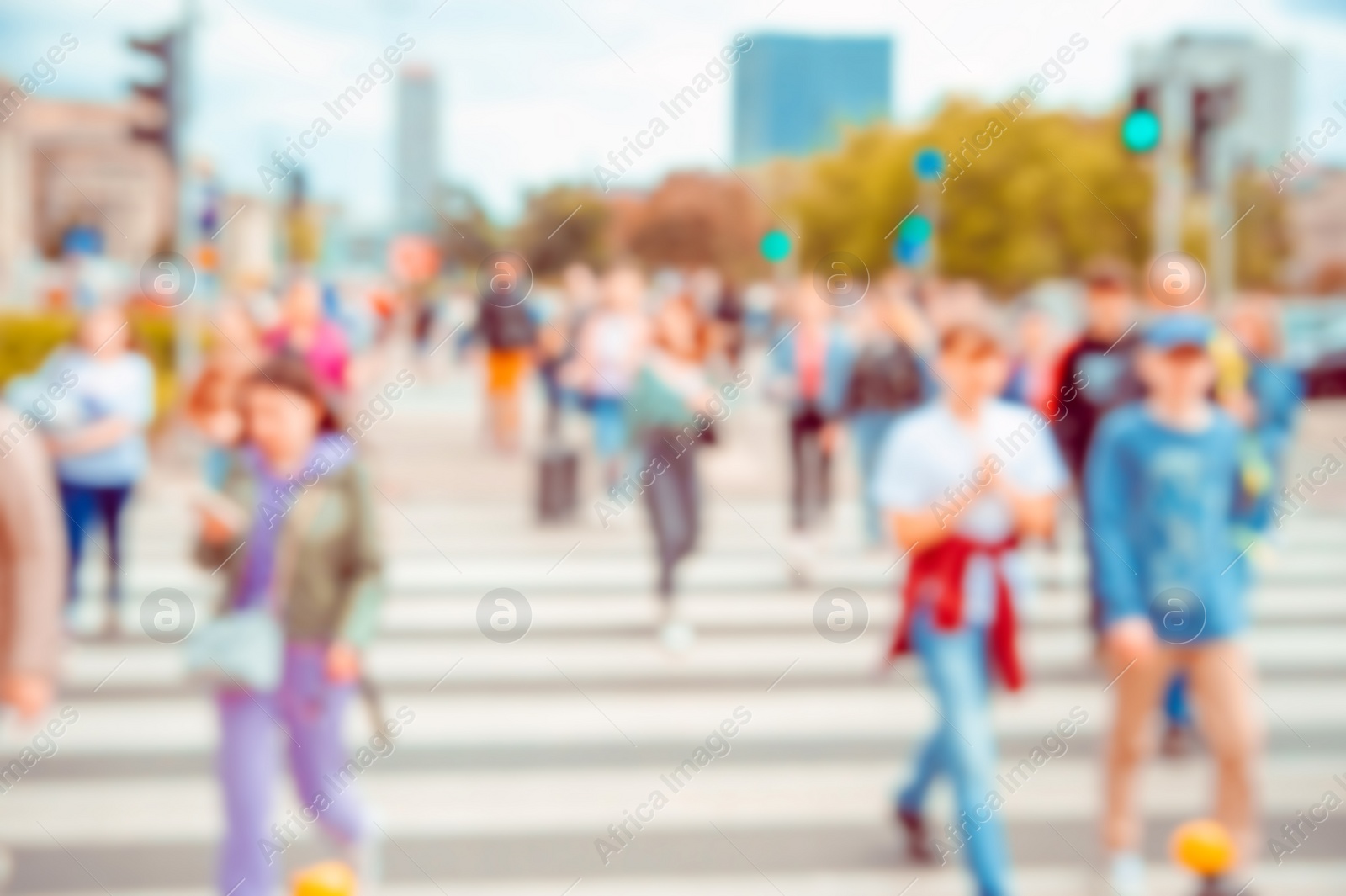 Photo of People crossing street in city, blurred view