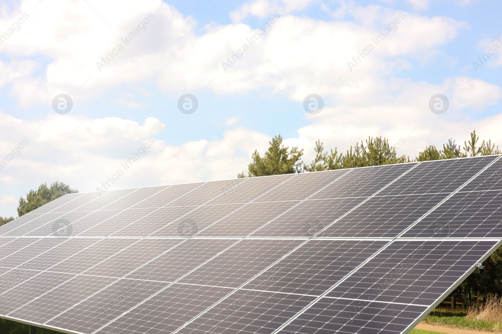 Photo of Solar panels outdoors on sunny day. Alternative energy