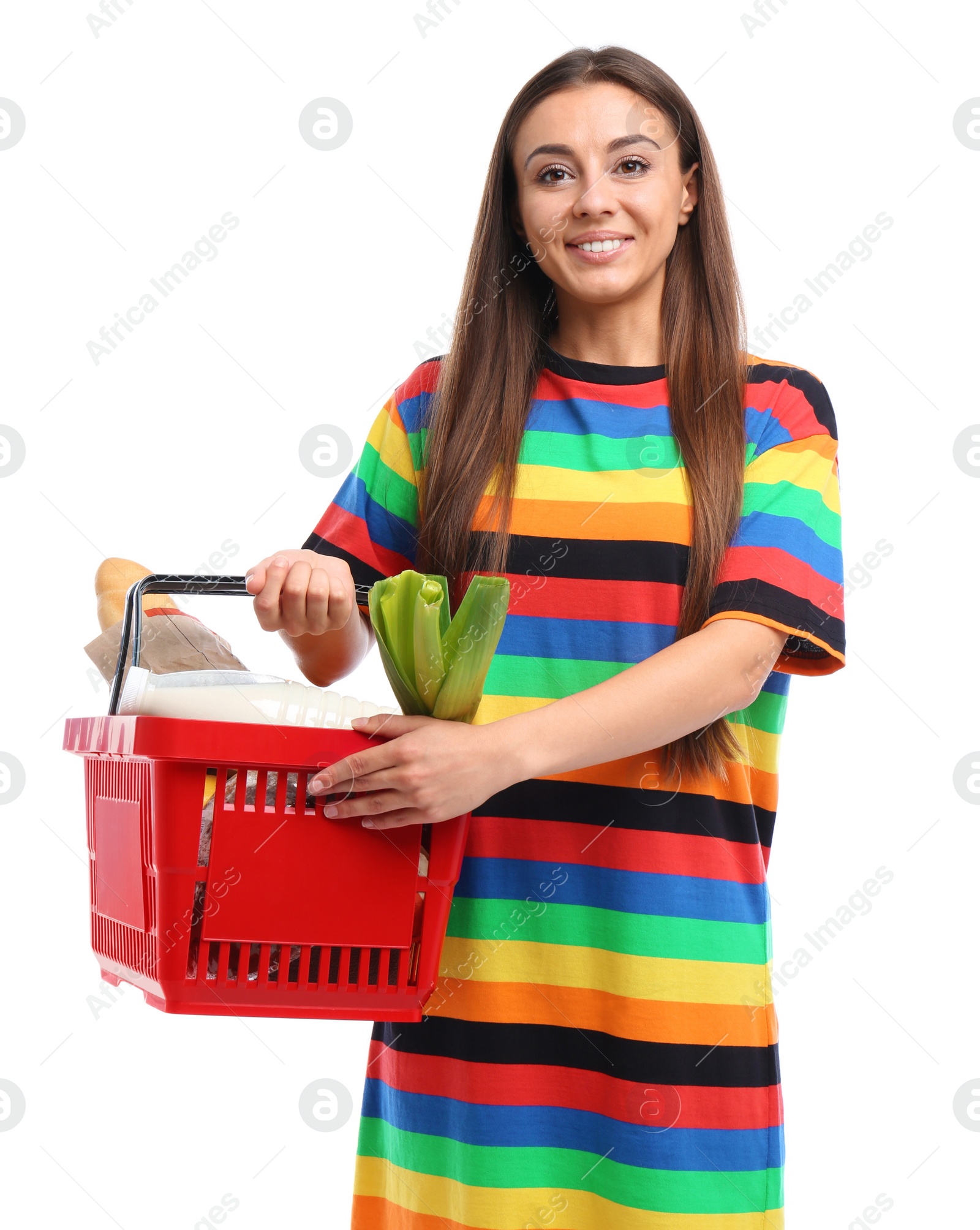 Photo of Young woman with shopping basket full of products isolated on white