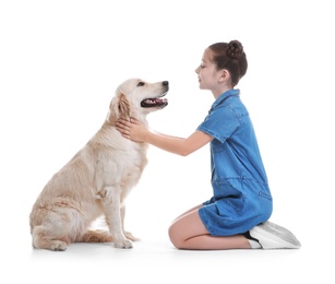 Photo of Cute little child with her pet on white background