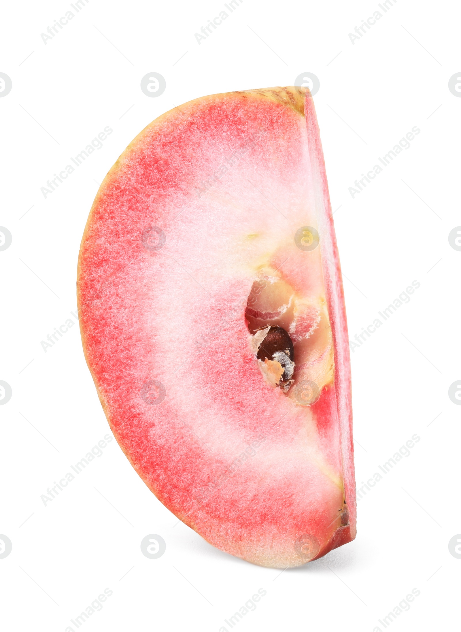 Photo of Slice of tasty apple with red pulp isolated on white