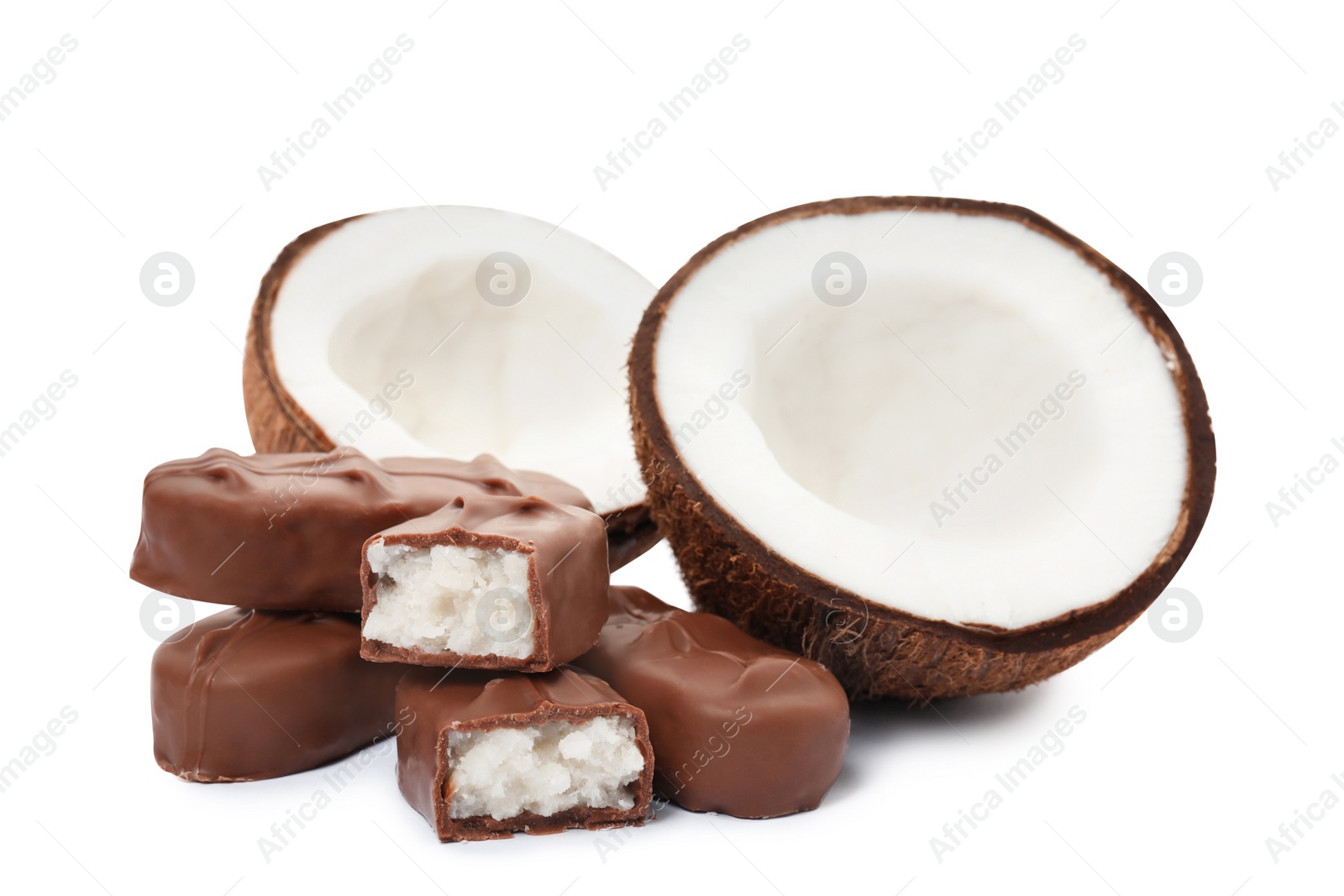 Photo of Delicious milk chocolate candy bars with coconut filling on white background