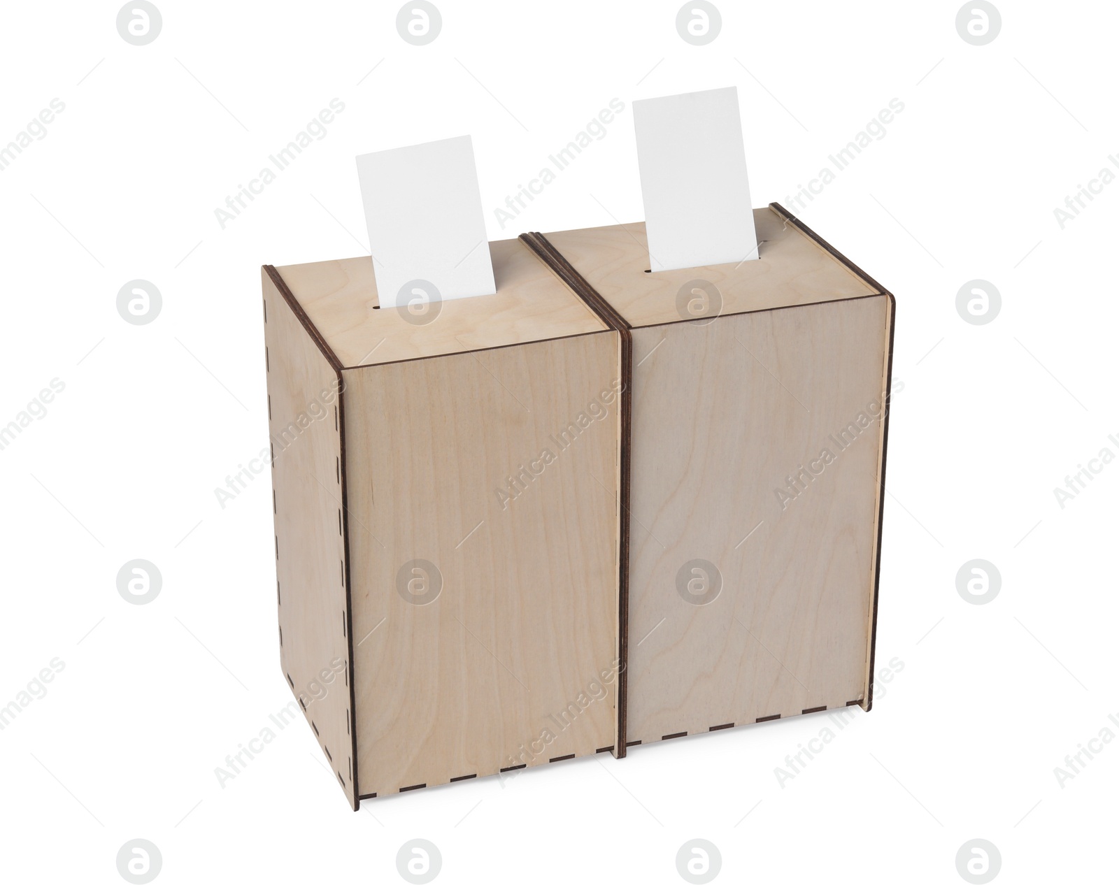 Photo of Wooden ballot boxes with votes isolated on white