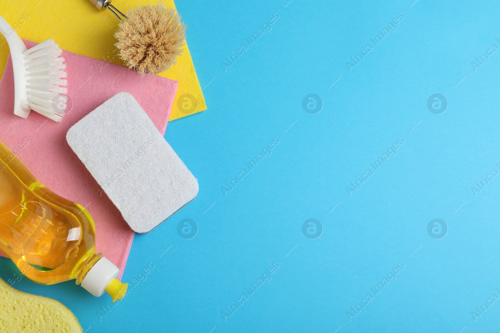 Photo of Flat lay composition with white sponge on light blue background. Space for text