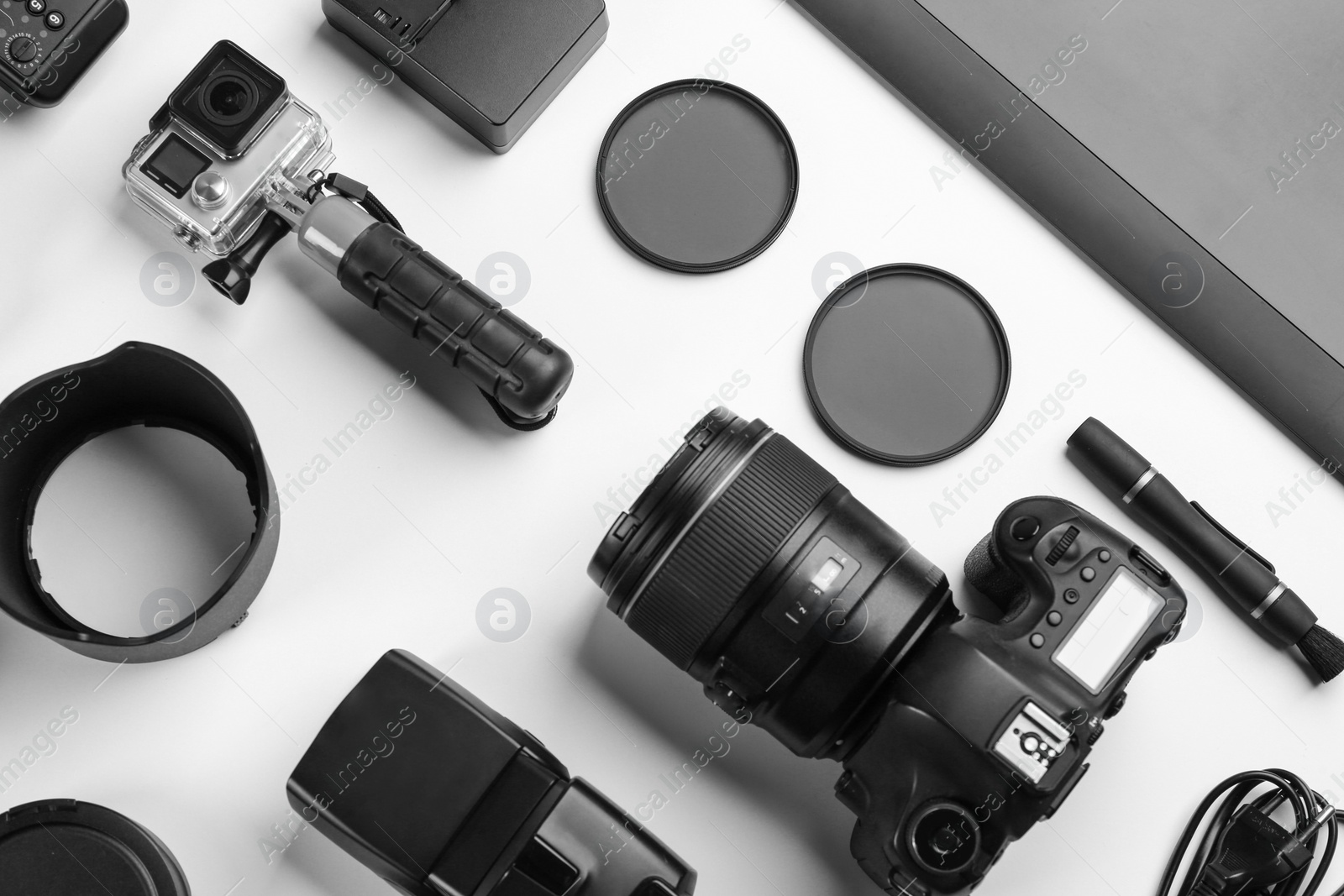 Photo of Composition with photographer's equipment and accessories on white background, top view