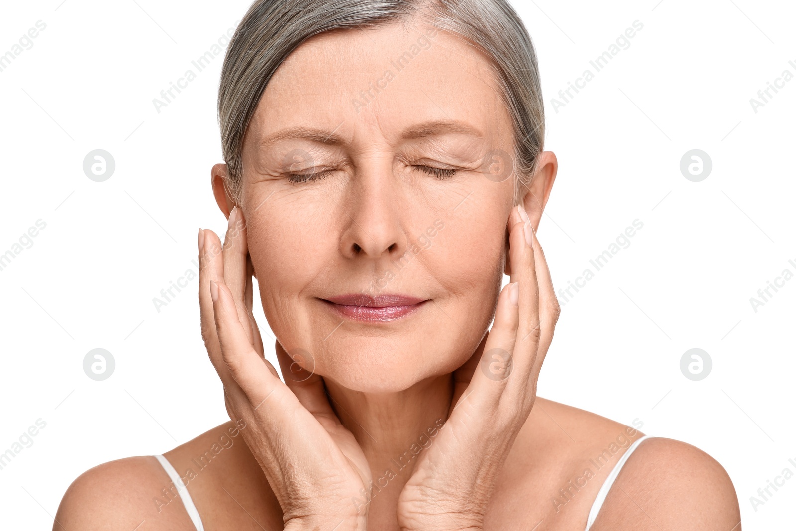 Photo of Portrait of senior woman with aging skin on white background. Rejuvenation treatment