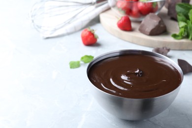 Photo of Delicious chocolate cream on light grey marble table, space for text