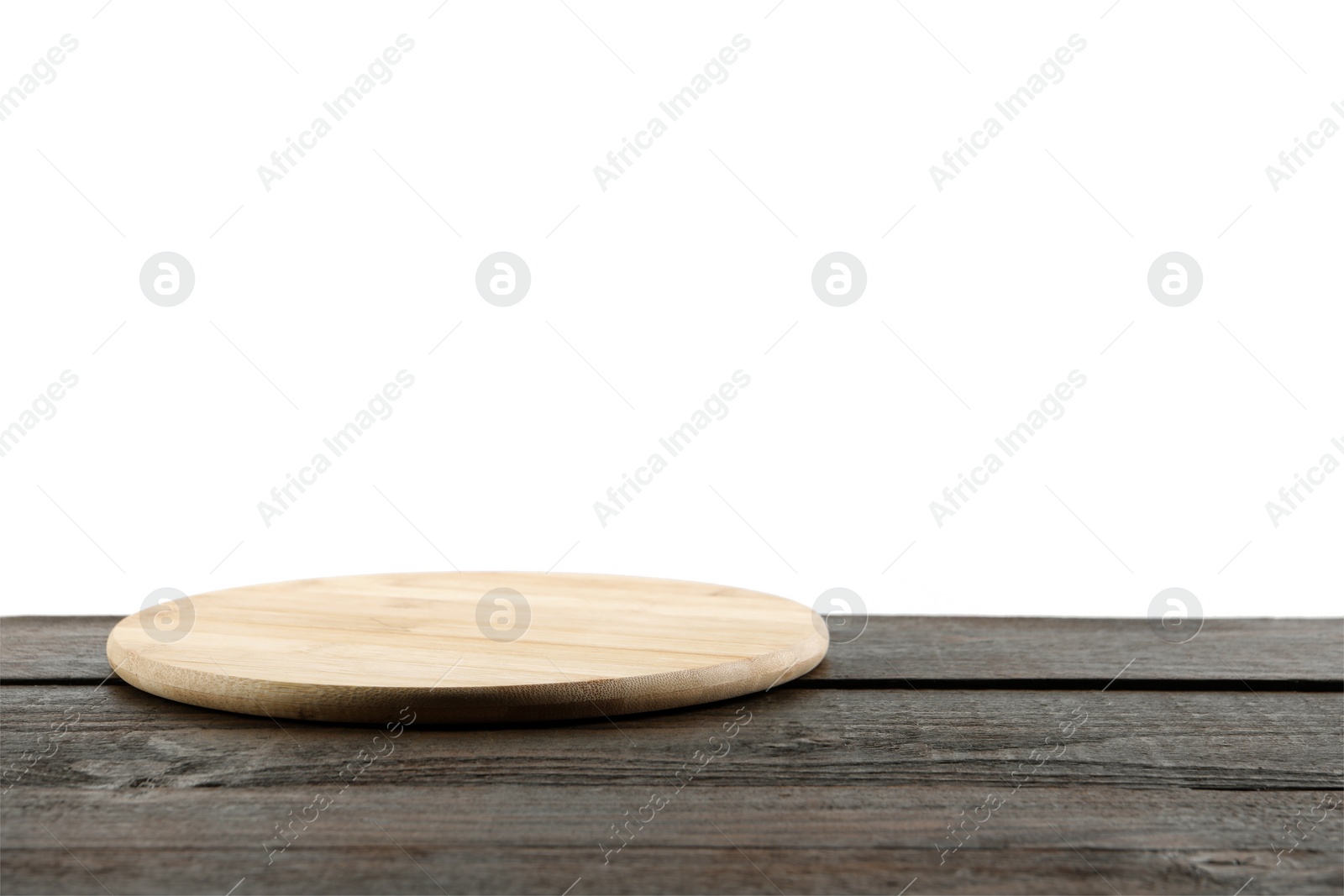 Photo of Empty board on wooden table. Space for text