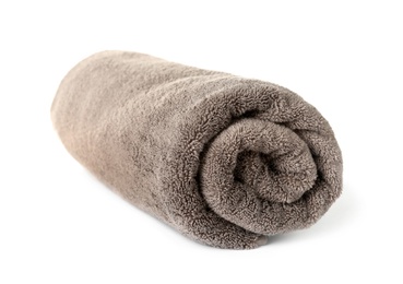 Photo of Rolled clean brown towel on white background