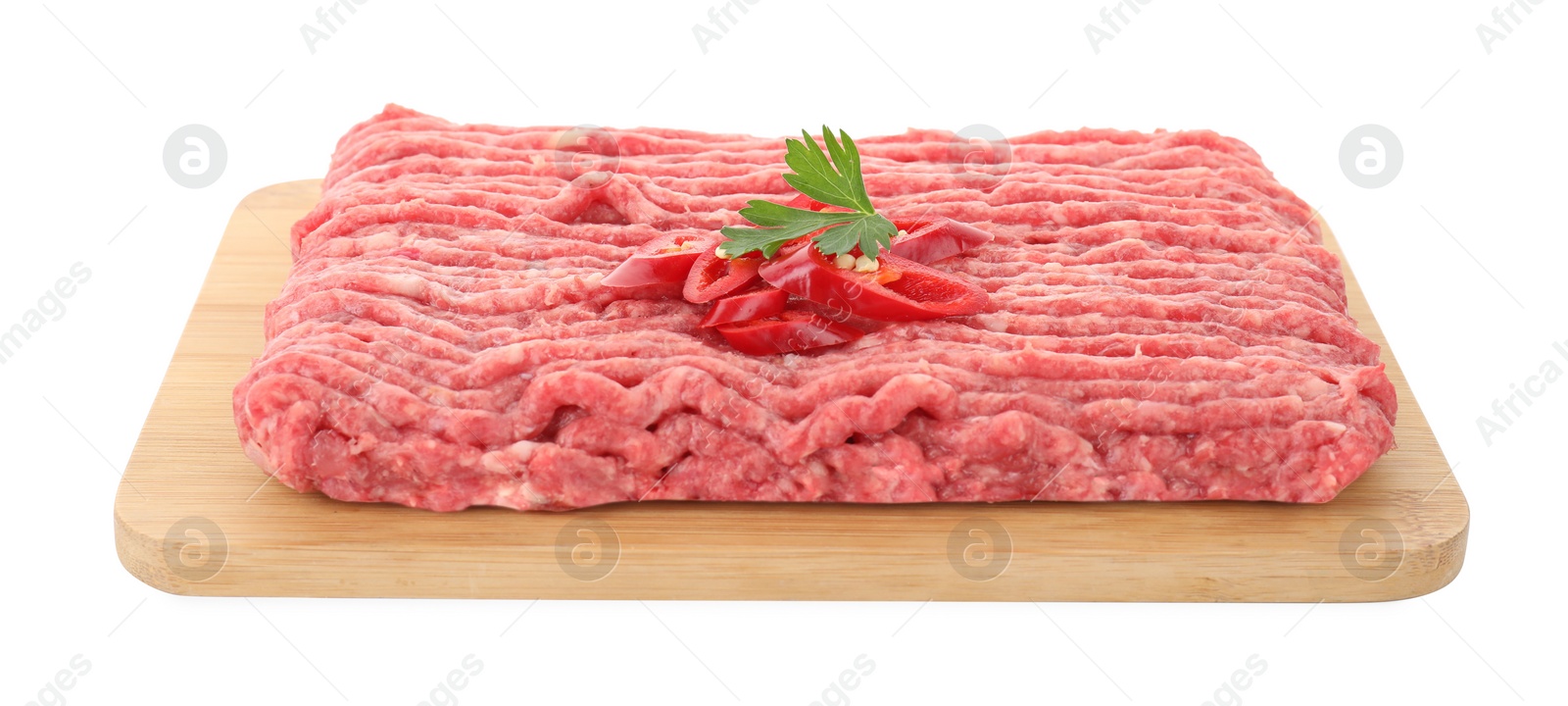 Photo of Board with raw ground meat, chili pepper and parsley isolated on white