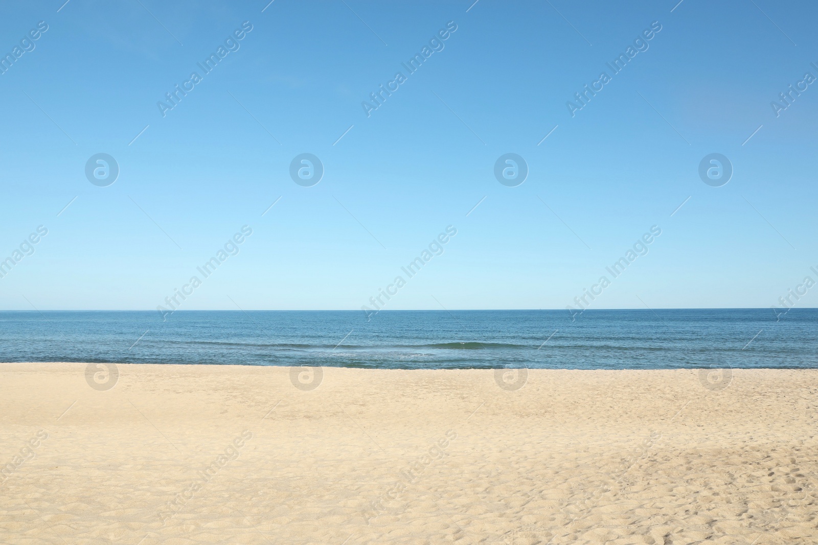 Photo of Picturesque view of sandy beach near sea