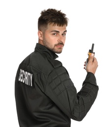 Male security guard in uniform using portable radio transmitter on white background