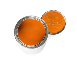 Photo of Can and lid with orange paint on white background, above view
