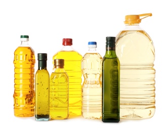 Photo of Bottles with different oils on white background