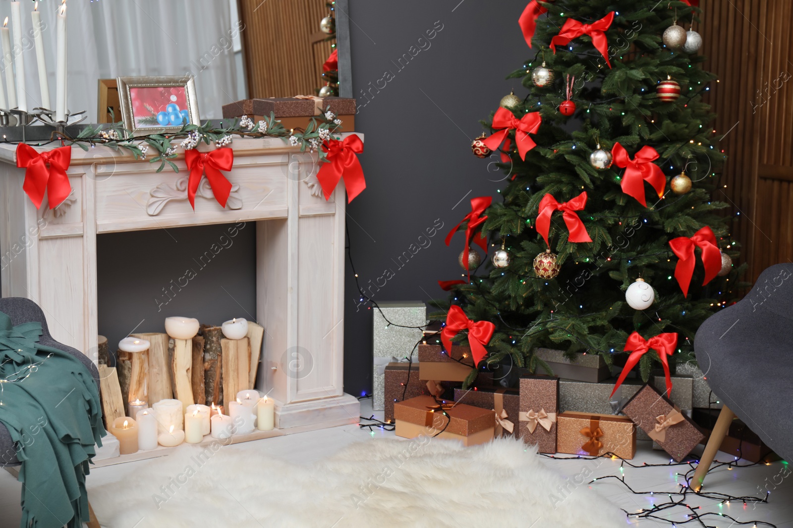 Photo of Stylish living room interior with decorated Christmas tree