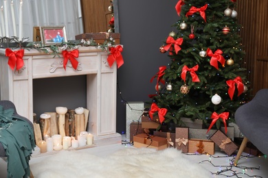 Photo of Stylish living room interior with decorated Christmas tree