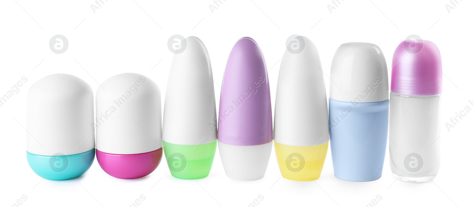 Photo of Different female roll-on deodorants on white background. Skin care