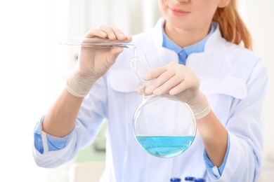 Photo of Scientist working in laboratory, closeup. Research and analysis