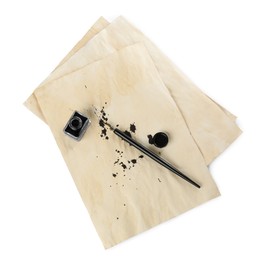 Parchment with stains of ink, fountain pen and inkwell on white background, top view