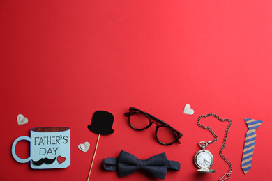 Photo of Flat lay composition male accessories on red background, space for text. Happy Father's day
