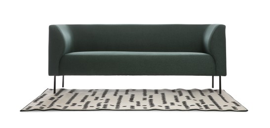 Photo of Comfortable green sofa and carpet white background. Furniture for living room interior