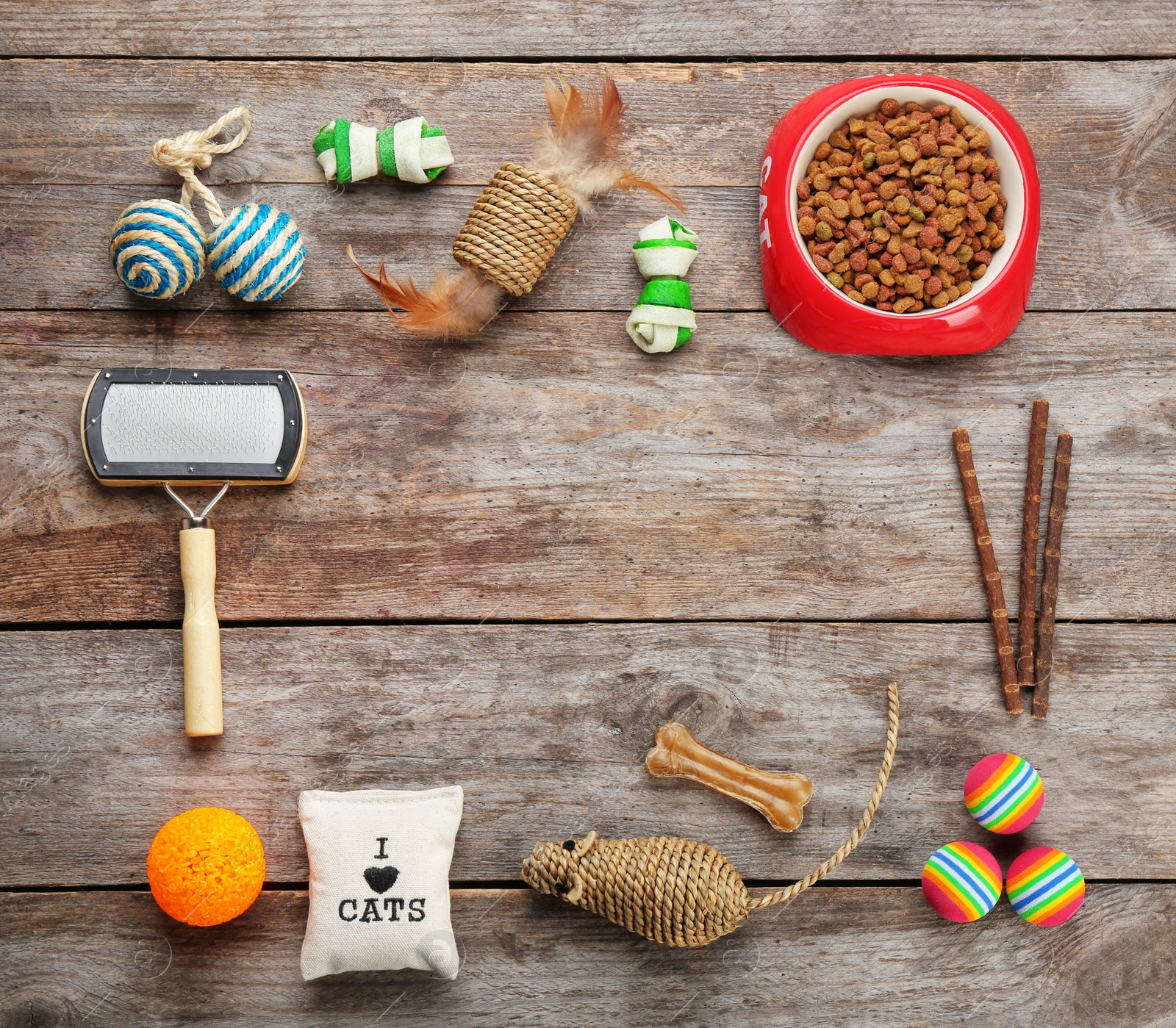 Photo of Flat lay composition with cat accessories and food on wooden background