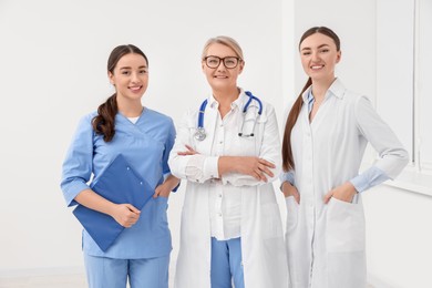 Photo of Portrait of medical doctors wearing uniforms indoors