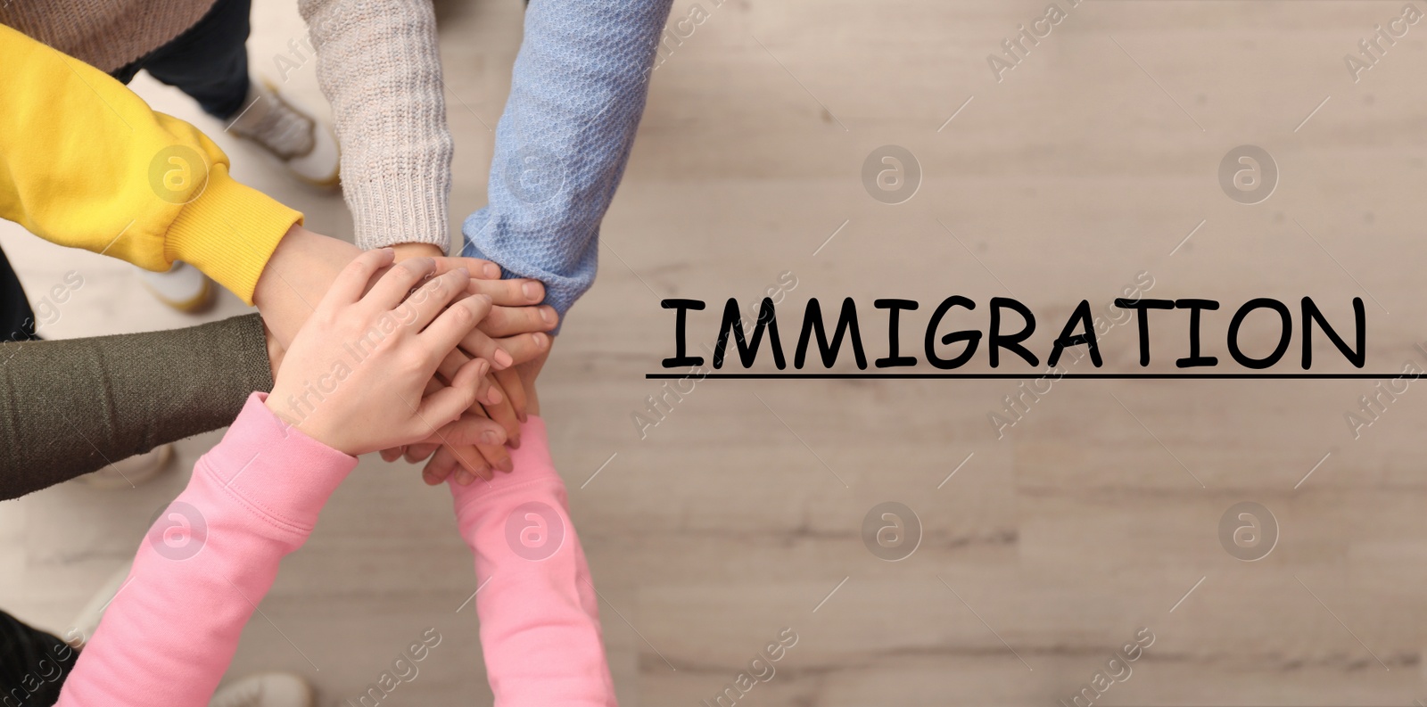 Image of Immigration concept. People holding hands together, top view