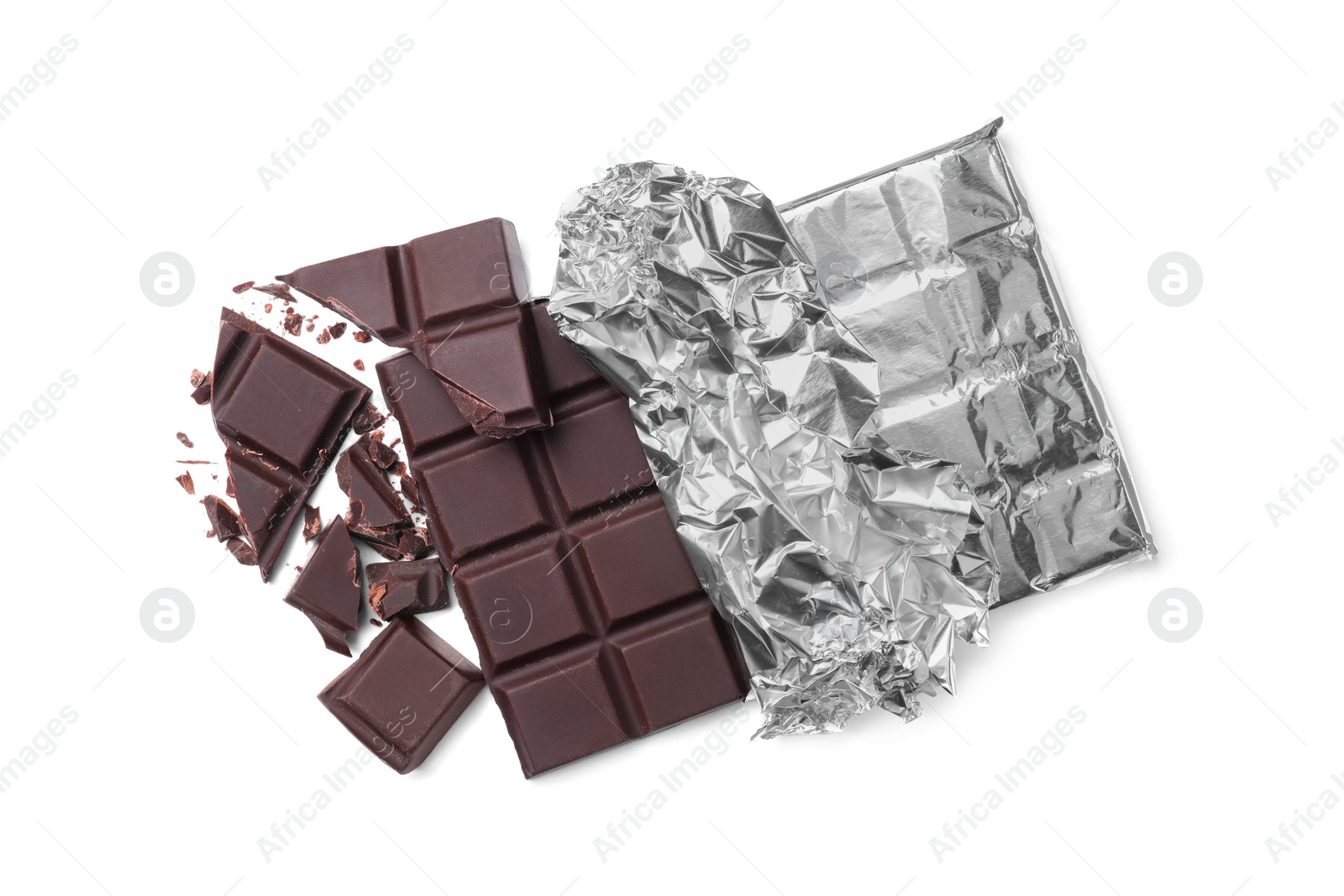 Photo of Pieces of delicious dark chocolate bar on white background, top view