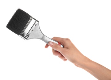 Photo of Woman holding paint brush on white background, closeup