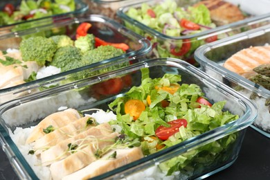 Healthy food. Different meals in glass containers on table, closeup