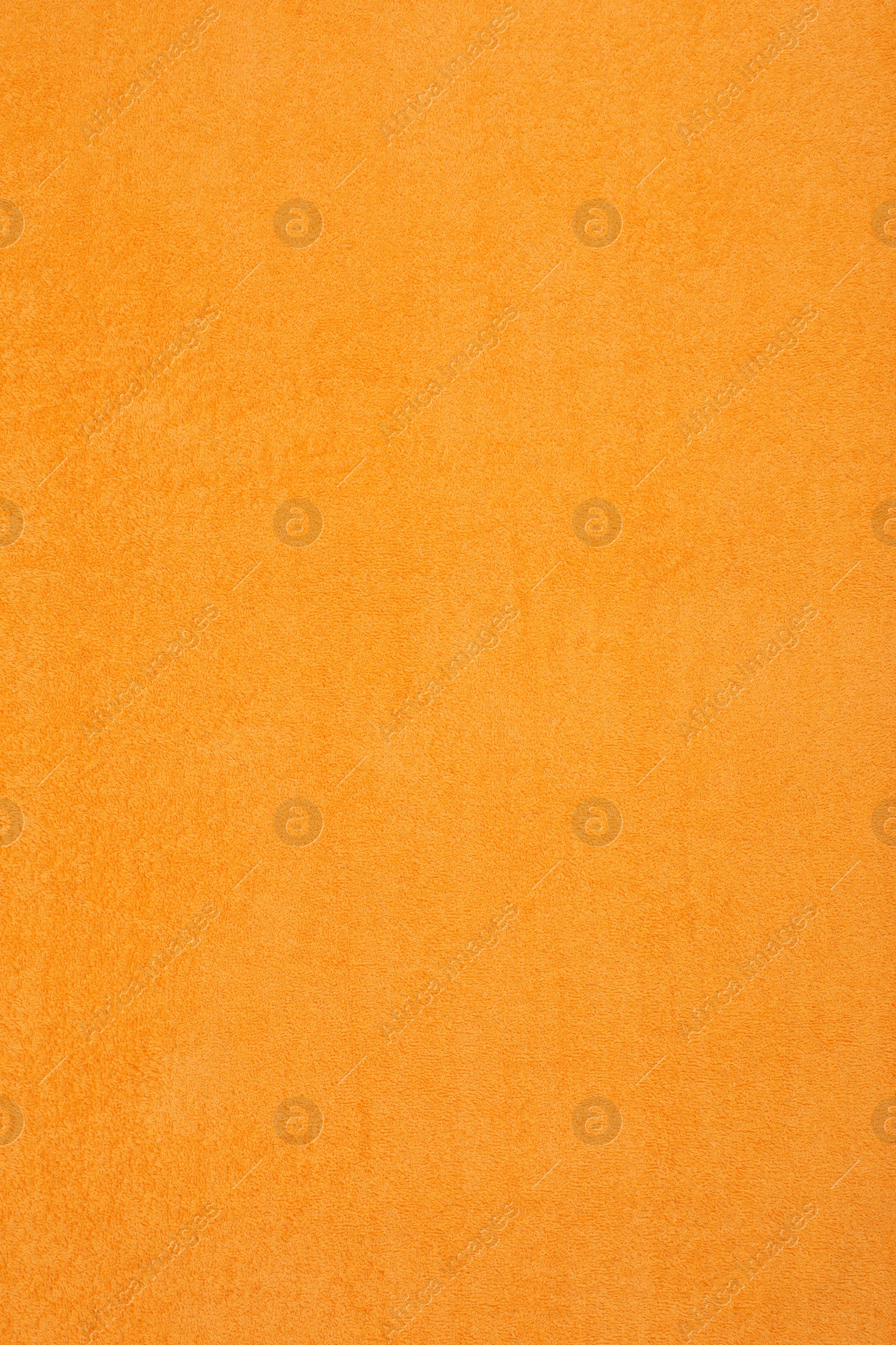 Photo of Orange beach towel as background, top view