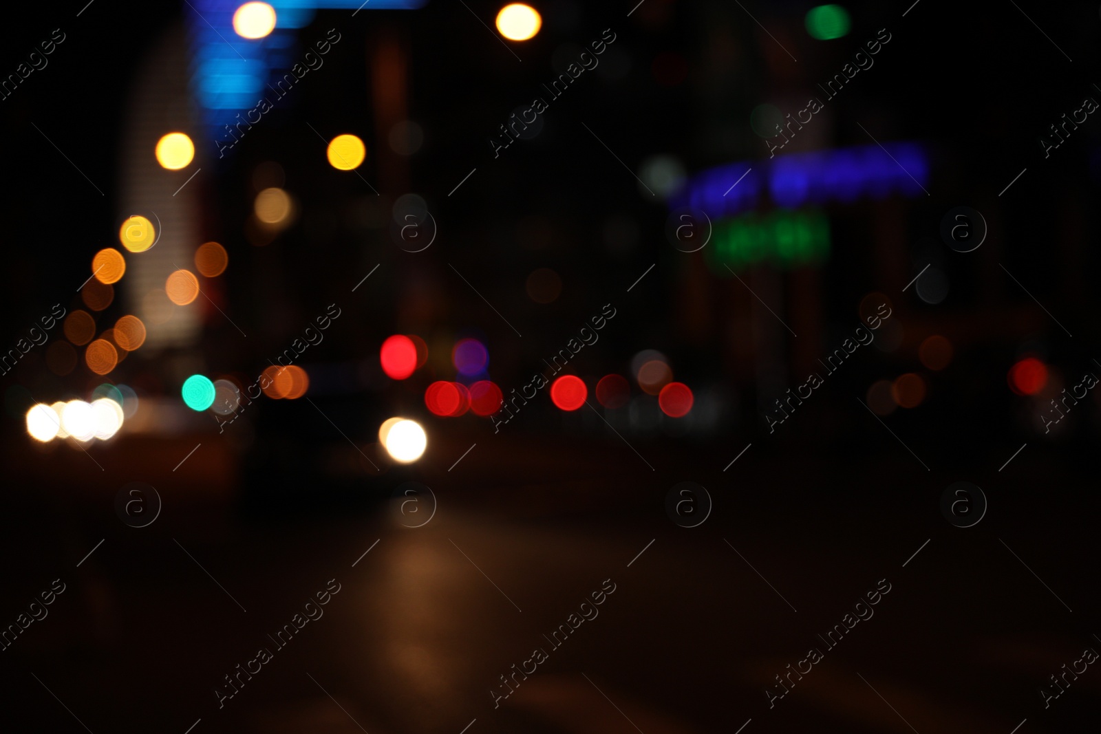 Photo of Blurred view of cityscape with bokeh effect. Night life