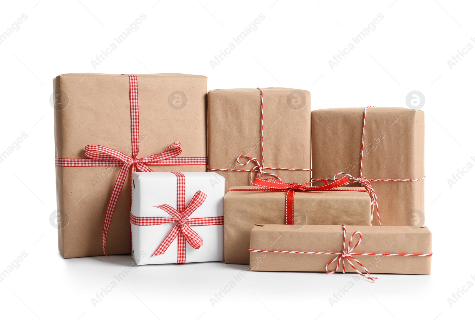 Photo of Beautifully wrapped gift boxes on white background