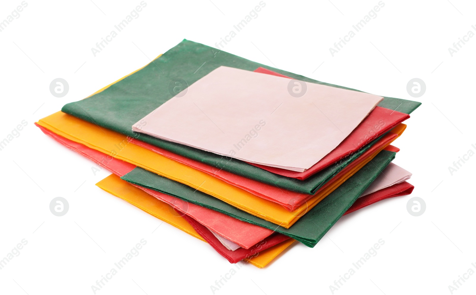 Photo of Colorful reusable beeswax food wraps on white background