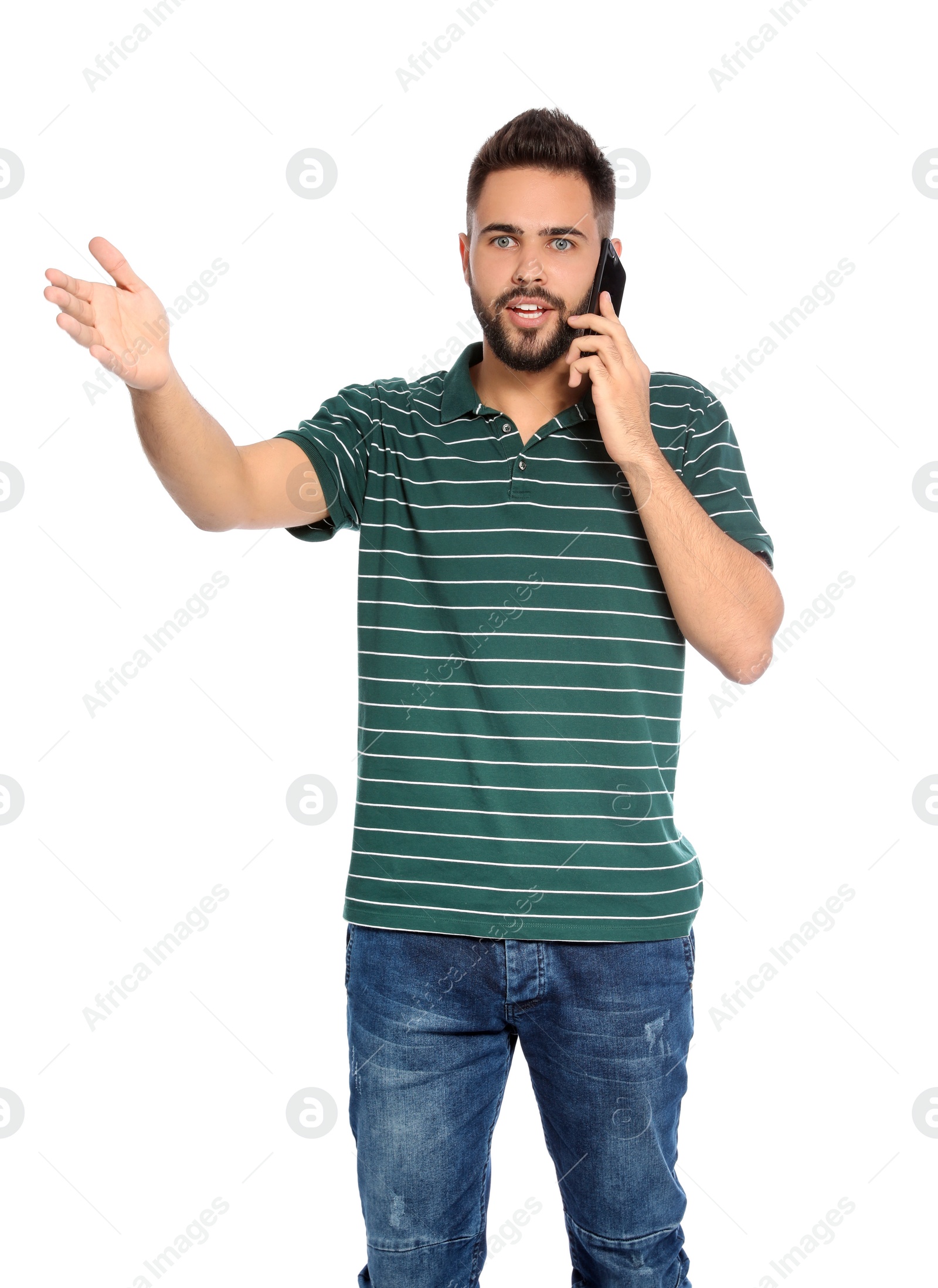 Photo of Portrait of handsome young man with mobile phone on white background