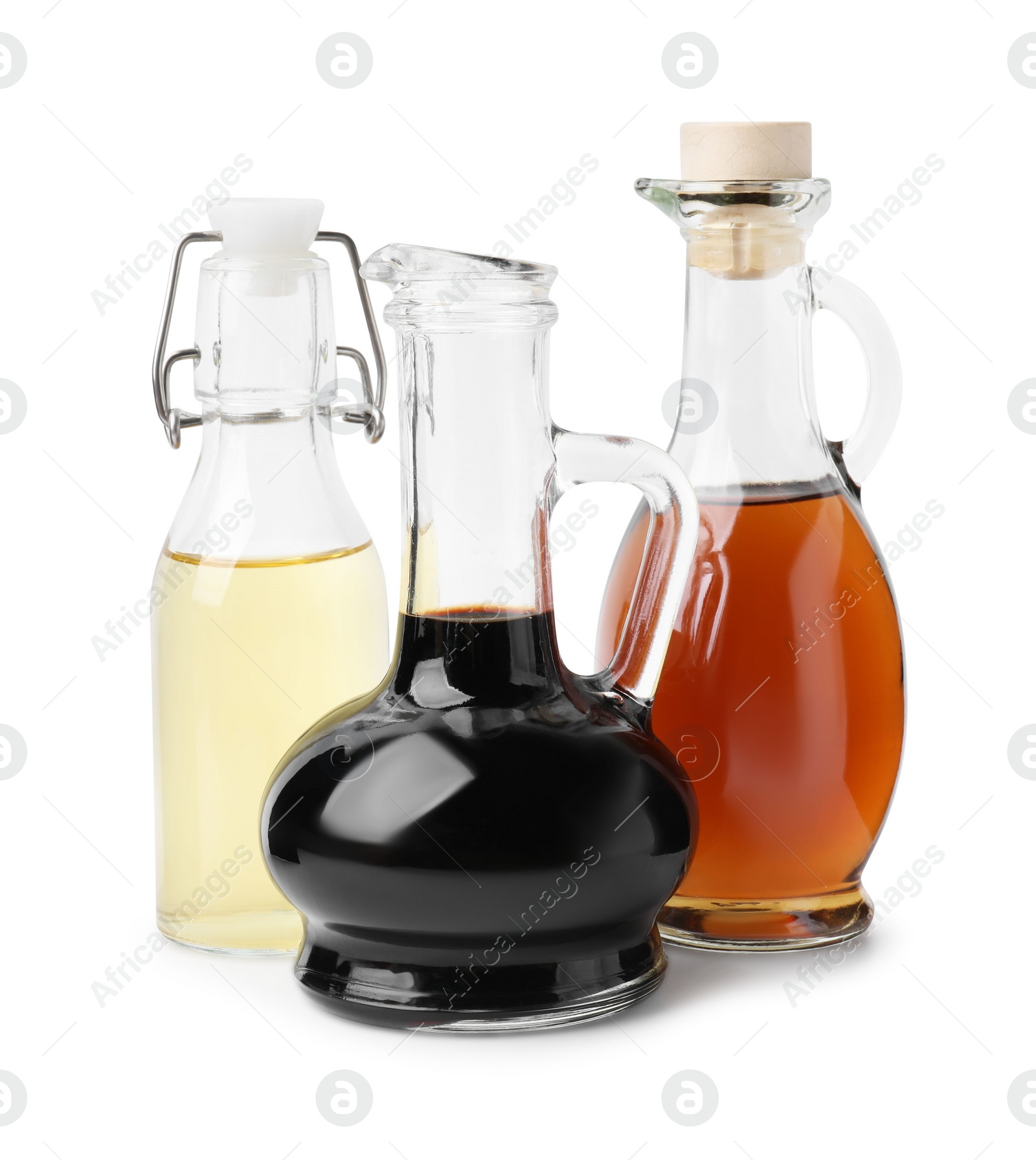 Photo of Different types of vinegar isolated on white