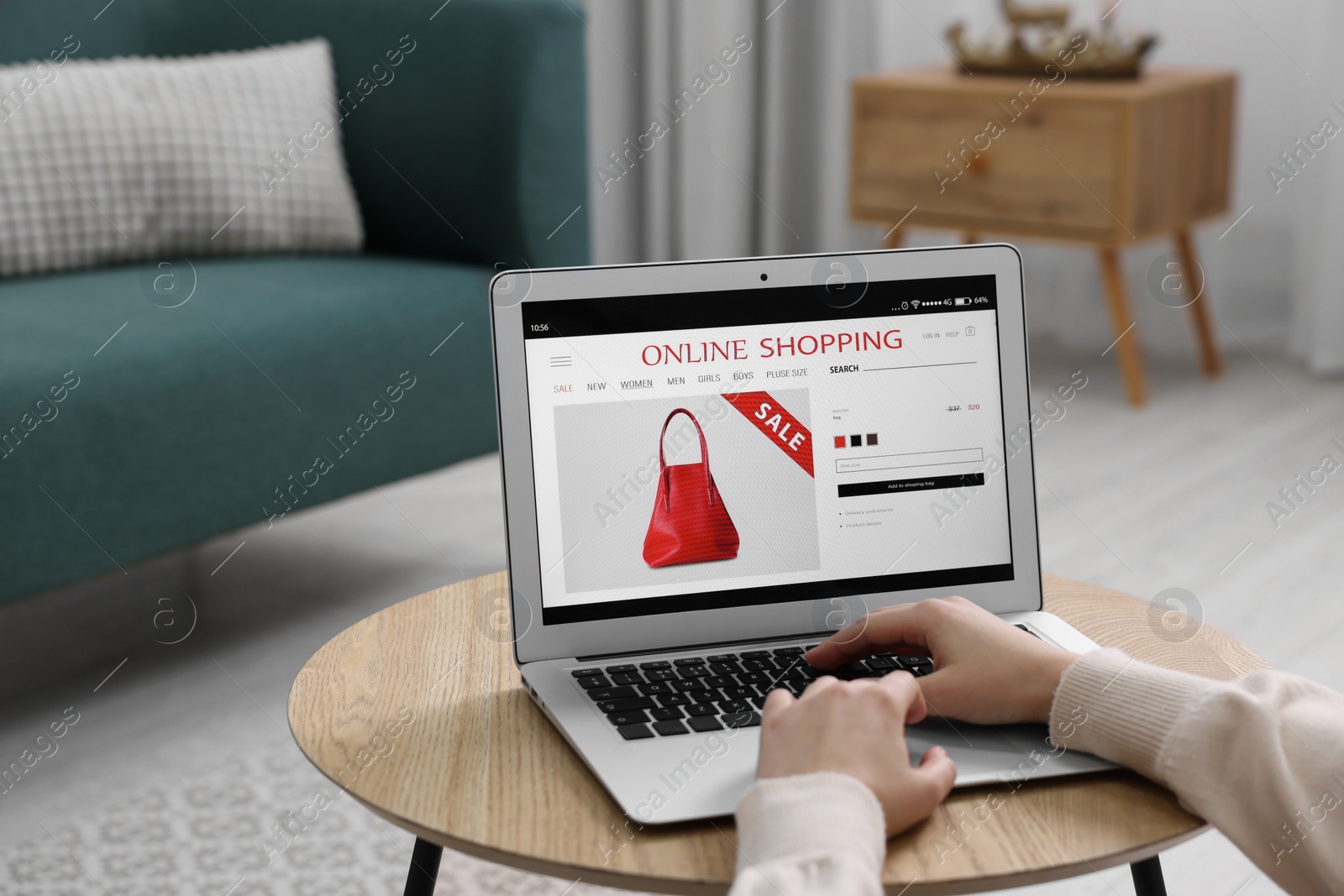 Photo of Woman shopping online during sale on laptop at home, closeup. Space for text