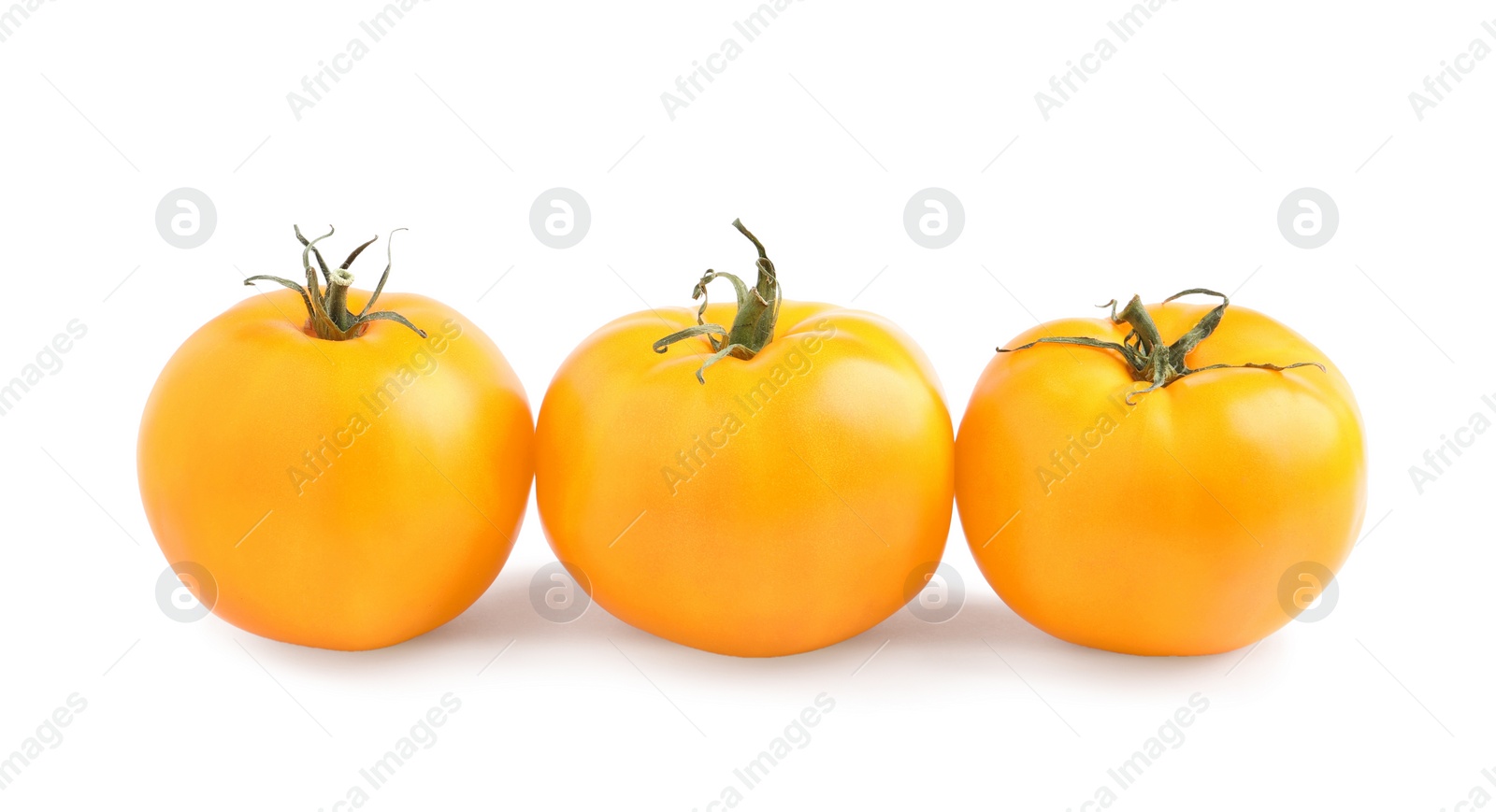 Photo of Fresh ripe yellow tomatoes on white background